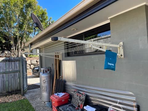 Extended wall-mounted clothesline