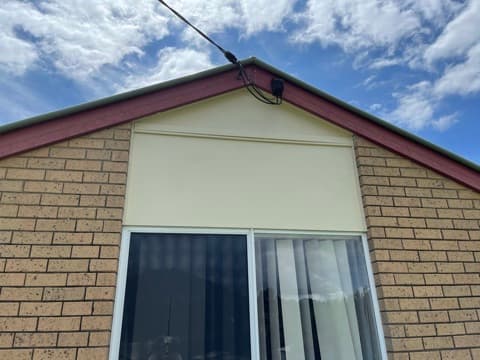 Finished exterior gable above a window
